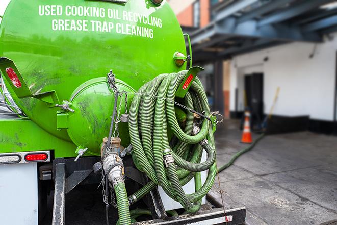 a pump truck emptying a grease trap in Bermuda Dunes